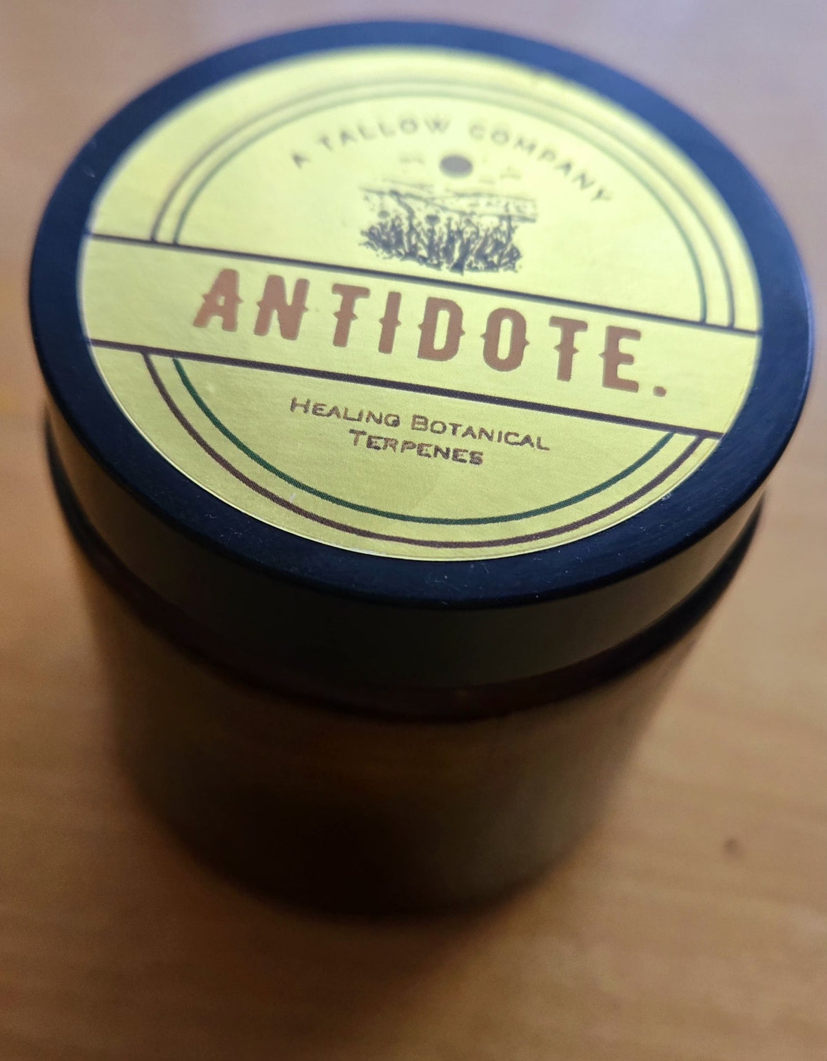 Antidote tallow balm in a 100ml amber glass jar